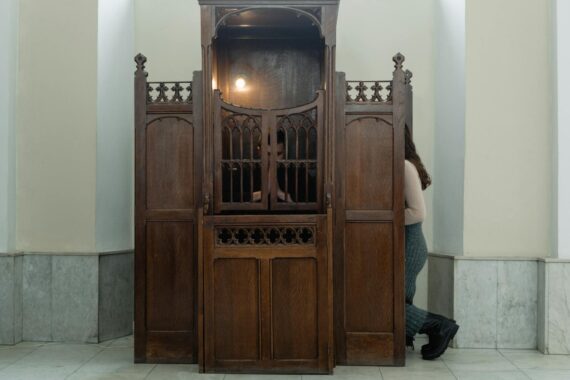 a person inside a confessional