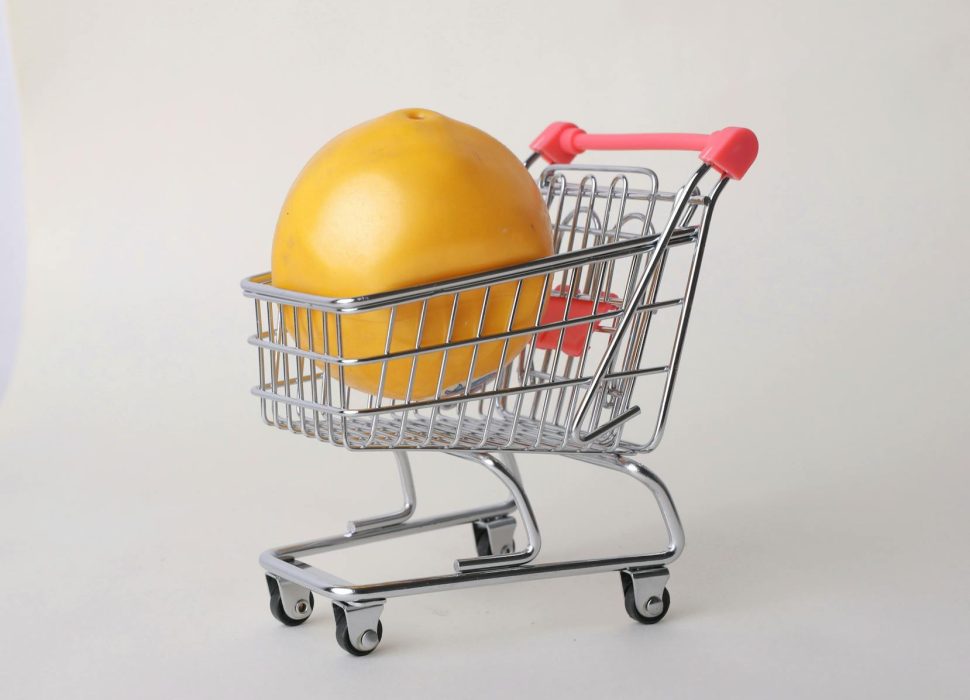 yellow round fruit on stainless steel shopping cart